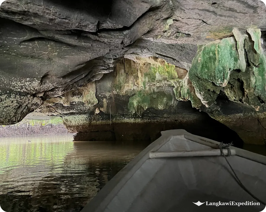 Inside view from a boat passing directly through Crocodile Cave limestone cavern